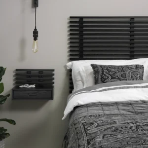 Zece beside drawer and headboard in black-stained ash in bedroom