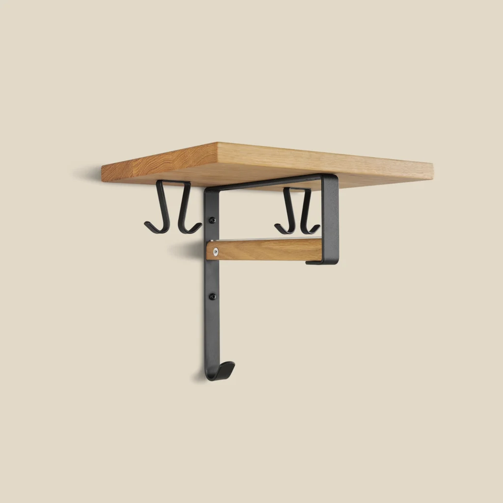 Cott hat rack in oiled oak with matt black steel on beige background