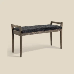 Meja bench in smoked oak with dark grey sheepskin on beige background