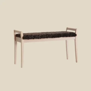 Meja bench in white oiled oak with brown sheepskin on beige background