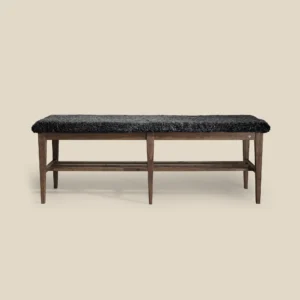 Nadja bench 130 in brown oiled ash with dark grey sheepskin on beige background