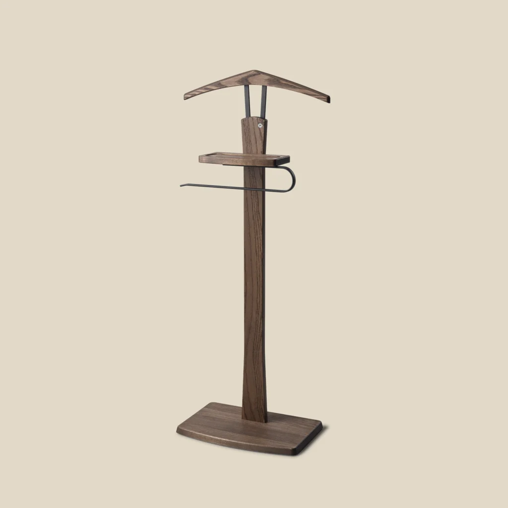 Zeve valet stand in brown oiled ash with matt black steel on beige background