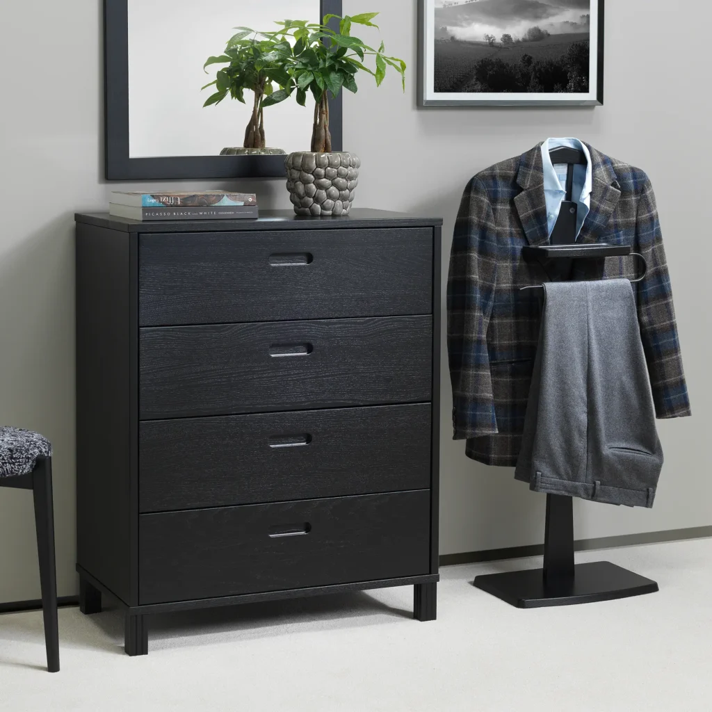 Zeve valet stand in black stained ash in bedroom with clothes on