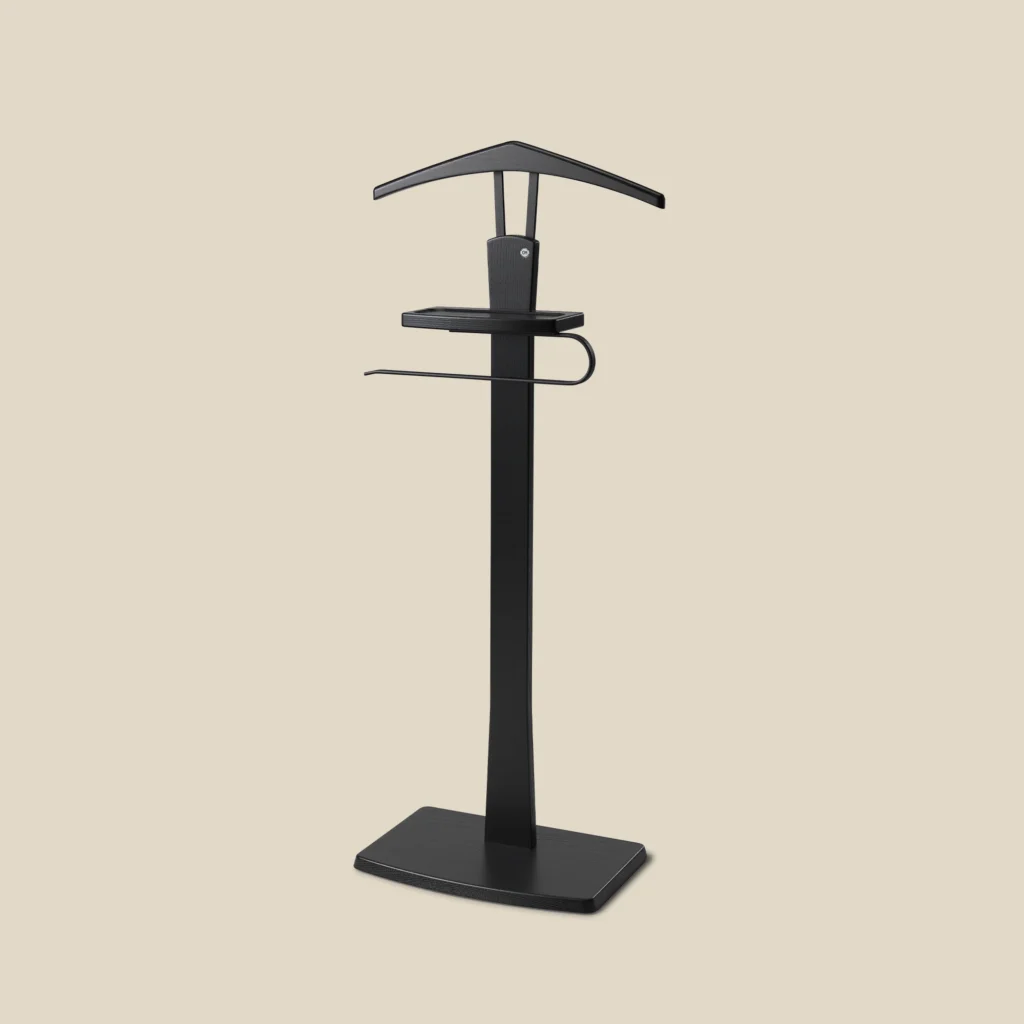 Zeve valet stand in black stained ash with matt black steel on beige background