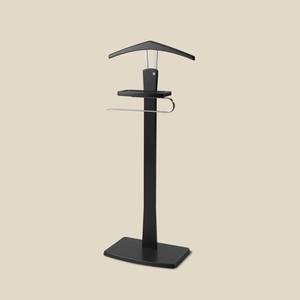 Zeve valet stand in black-stained ash with polished steel on beige background