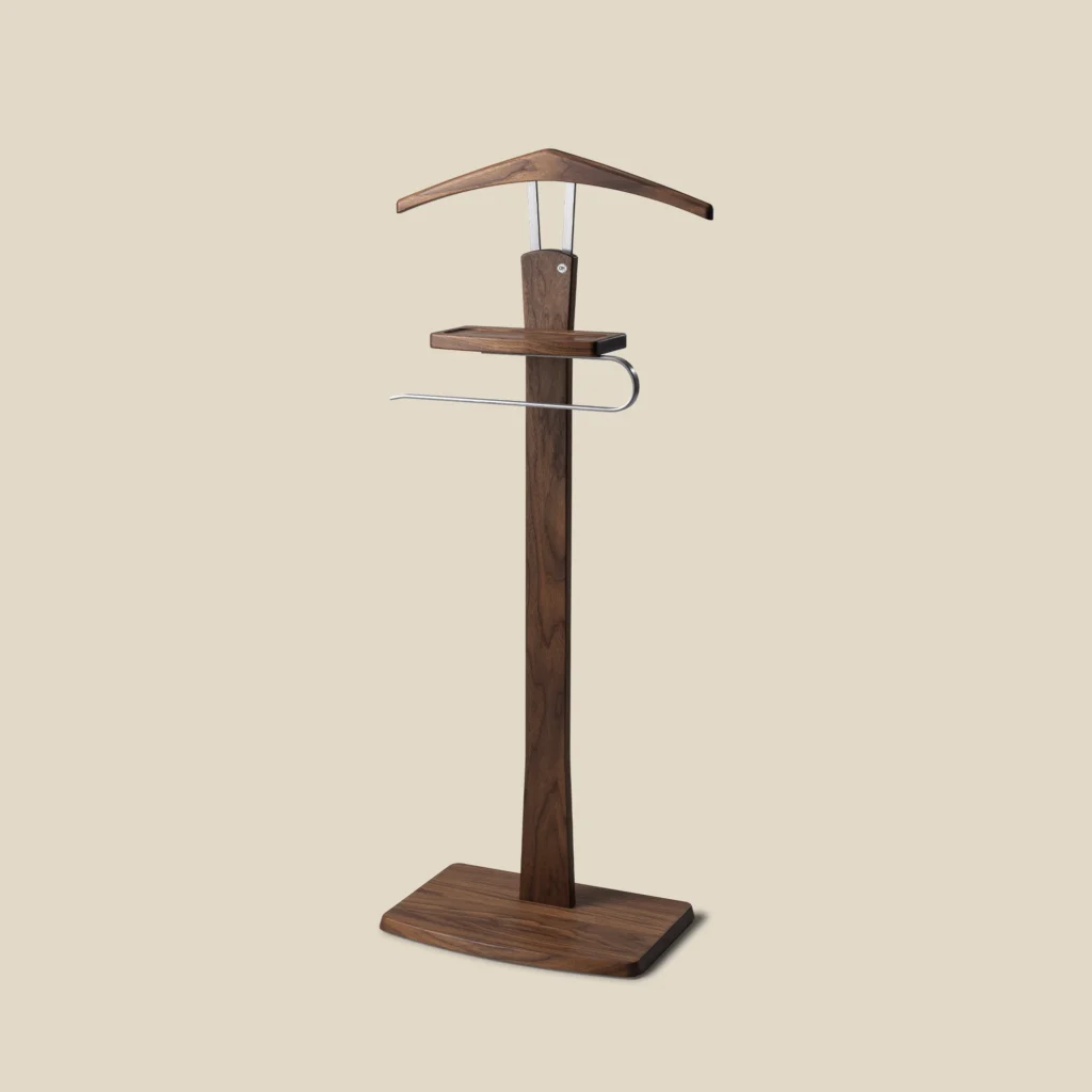 Zeve valet stand in walnut with polished steel on beige background