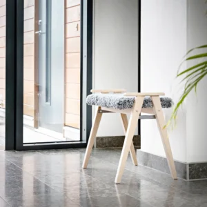 Alme stool white oiled oak with light grey sheepskin in hallway
