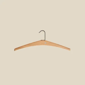 Cora hanger in lacquered oak on beige background