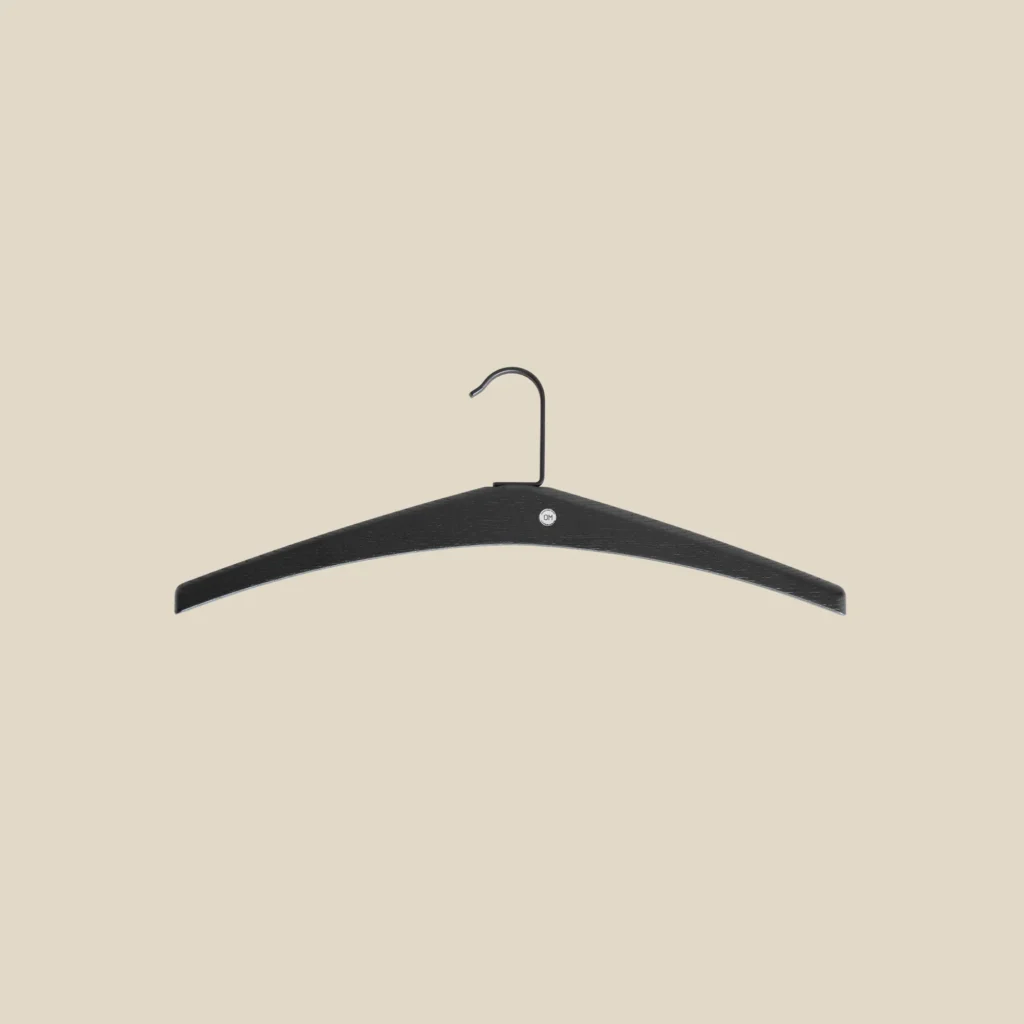 Cora hanger in black-stained oak on beige background