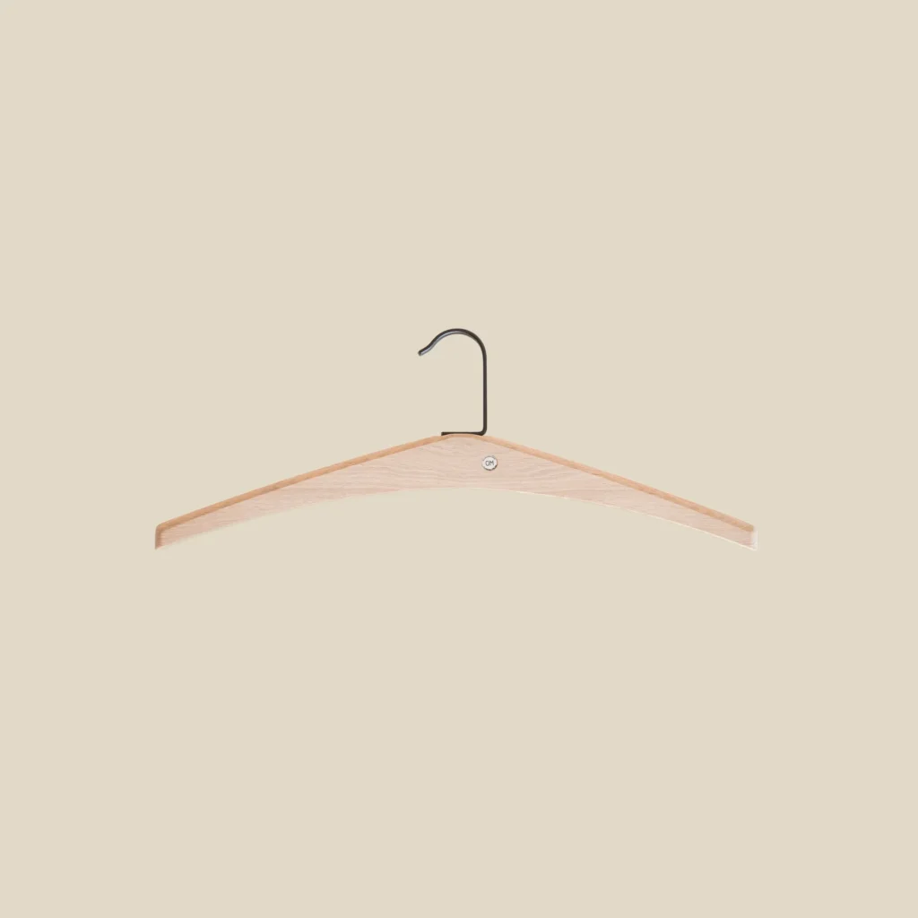 Cora hanger in white oiled oak on beige background