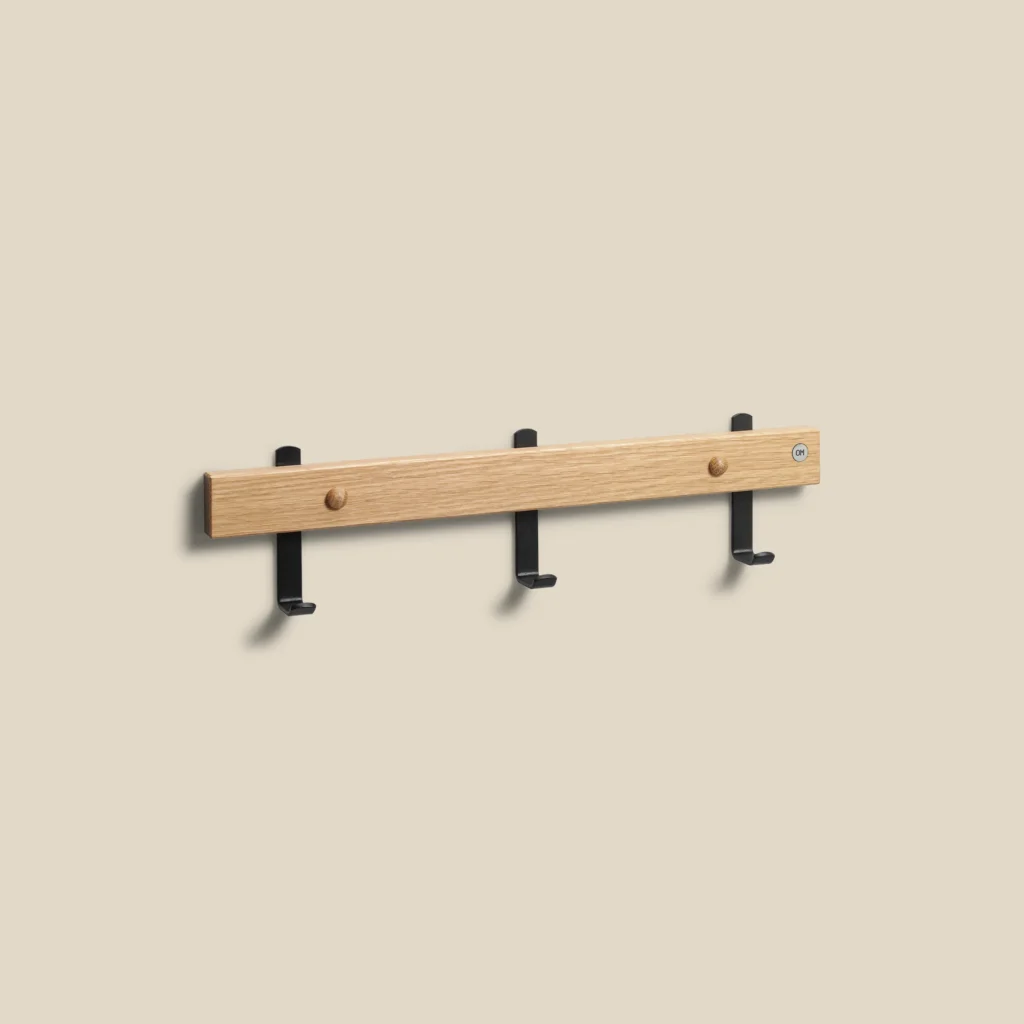 Nadja hook rail in lacquered oak with matt black steel L40 on beige background